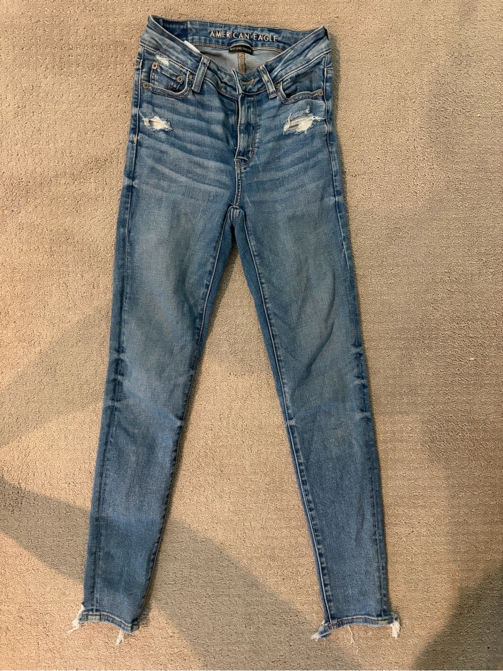 American Eagle Outfitters Light Blue Skinny Jeans with Distressed Knees